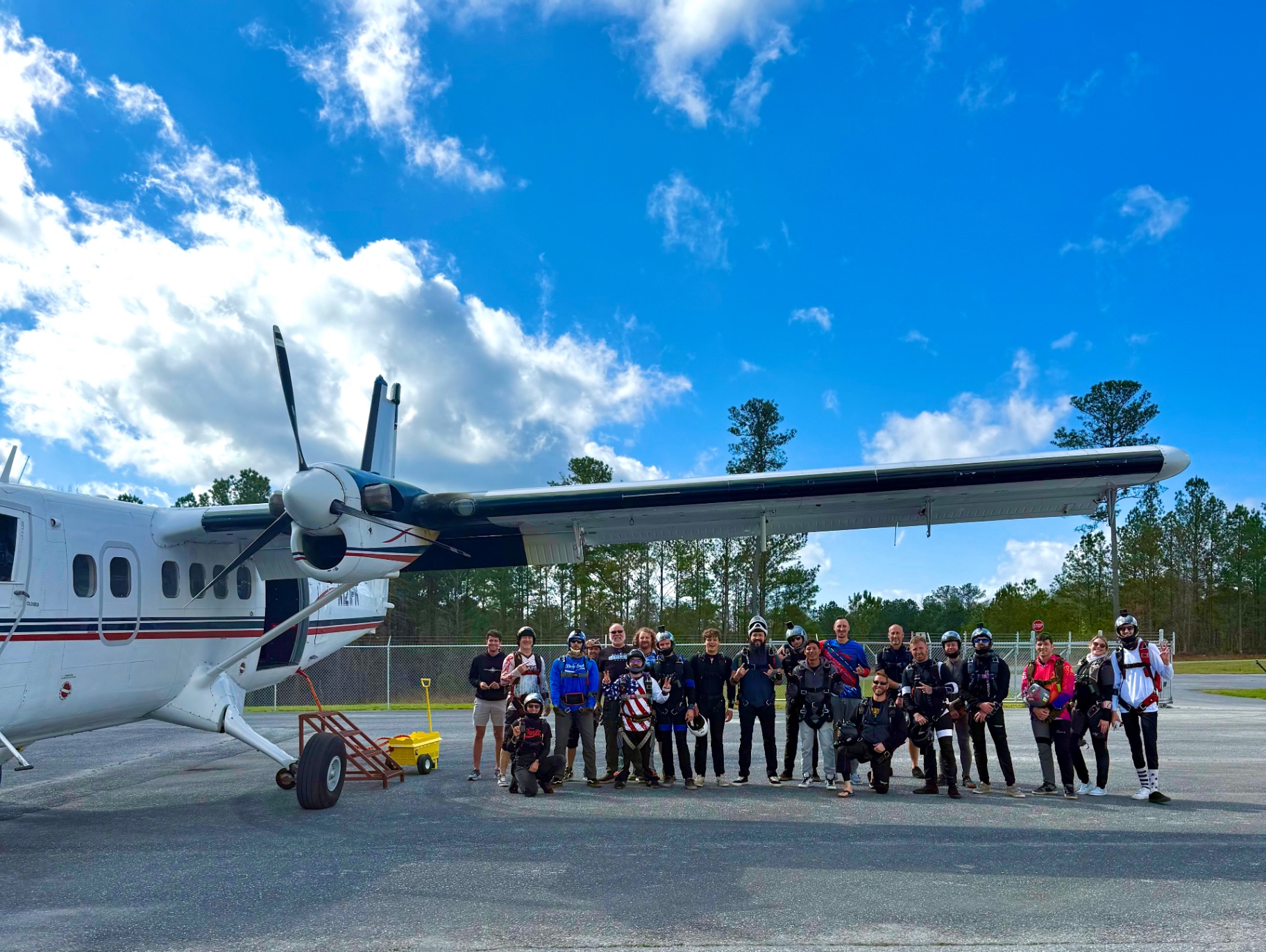 Skydive Georgia team next to aircraft on tarmac